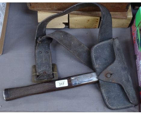 A Vintage fireman's axe, and leather holster with belt 