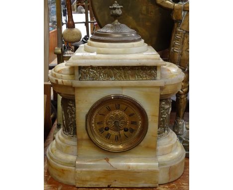 An alabaster-cased mantel clock with embossed brass panels, height 36cm 