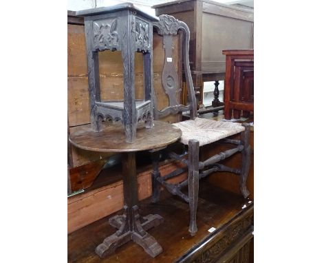 An Antique oak rush-seated chair, a carved oak triangular occasional table, and an oak lamp table (3) 