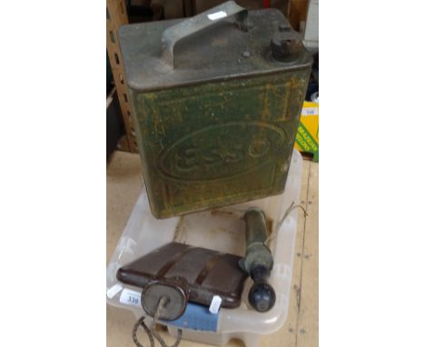 A Bakelite electric hot water bottle, an Esso petrol can with brass cap, and a garden sprayer 