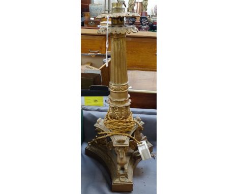 An ornate gilded-metal table lamp on tripod platform base, supported by Pegasus figures, height 45cm overall 