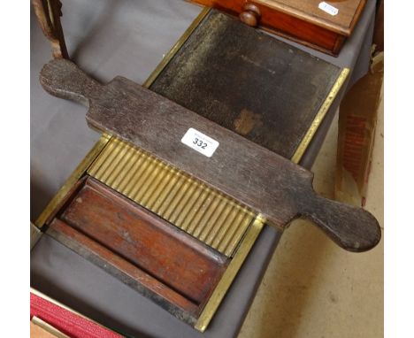 An Antique brass and mahogany pill roller, and a mahogany and brass postal scale and weights