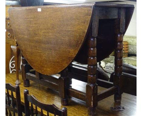 An Antique oak gateleg table on bobbin turned legs, W102cm 