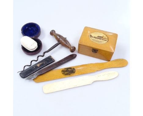 A Mauchline Ware letter opener, a corkscrew, an ivory scarab etc 