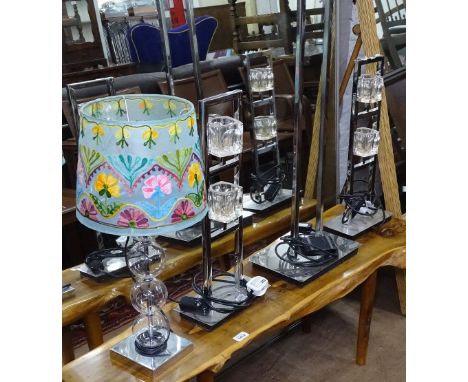 A pair of modern stylised chrome table lamps, and matching floor lamp. 