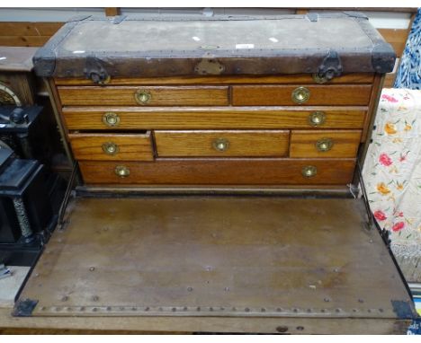 An American military Totty Trunk &amp; Bag Co Inc. Petersburg oak-fronted Campaign chest of drawers, with inset brass handles