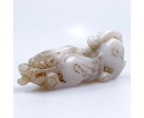 A Chinese carved jade animal, 11cm 