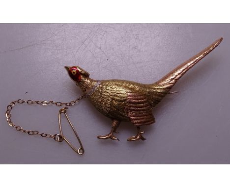 A 15ct 3-coloured gold and red enamel set figural pheasant brooch, 9g 