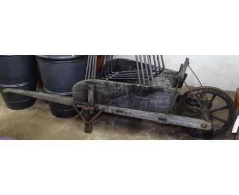A Vintage weathered wheelbarrow 