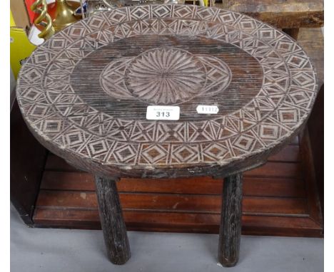 An Antique mahogany extending bookrack, and a chip carved stool with oval top, length 37cm 