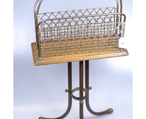 A Victorian brass mesh magazine/music stand on brass tripod base, height 75cm 