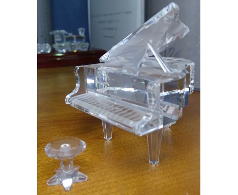 A boxed Swarovski grand piano and music stool 