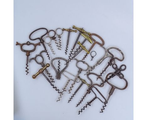A collection of Vintage metal corkscrews, including brass-handled 