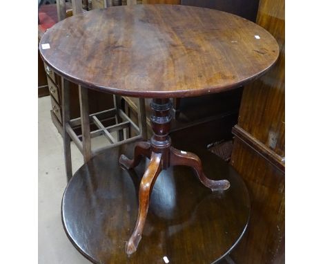 A Georgian mahogany circular tilt-top table on tripod base, W74cm 