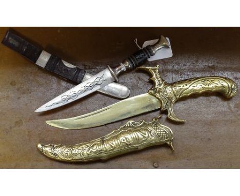 A brass dagger in scabbard, 31cm, and a smaller knife with inlaid decoration and scabbard