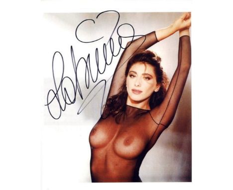 SALERNO SABRINA: (1968- ) Italian Singer and sex-symbol. Signed 8 x 10 colour photograph, the image showing the singer in a s