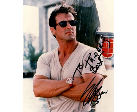 STALLONE SYLVESTER: (1946- ) American Actor. Colour signed and inscribed 8 x 10 photograph of Stallone, the image depicting t