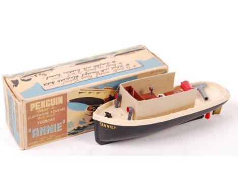 A charming vintage Penguin made ' Series 4 ' clockwork powered plastic model tugboat ' Annie '. Appears mint, very likely unu