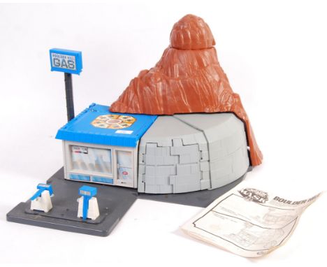 An original 1980's Kenner made MASK ' Boulder Hill ' action figure playset. Appears complete (unchecked), including the pumps