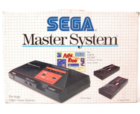 An original vintage boxed Sega Master System video games computer console with preloaded Alex Kidd game. Appears in good cond