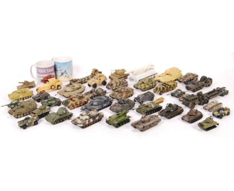 A collection of approx 30 assorted scale diecast and model military armoured vehicles with some by Solido, Unimax, and Matchb