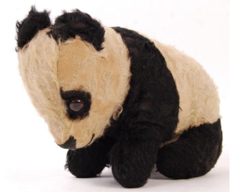 An original vintage 1930's Merrythought Toys mohair soft toy teddy bear panda having horizontal stitched nose, stitched label