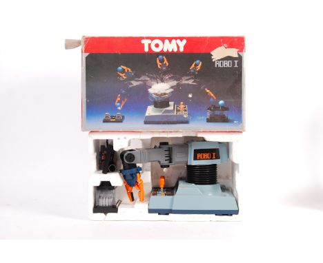 An original vintage 1980's Tomy made ' Robo I ' or ' Robo 1 ' robotic toy playset. Appears complete, with all discs and ball 
