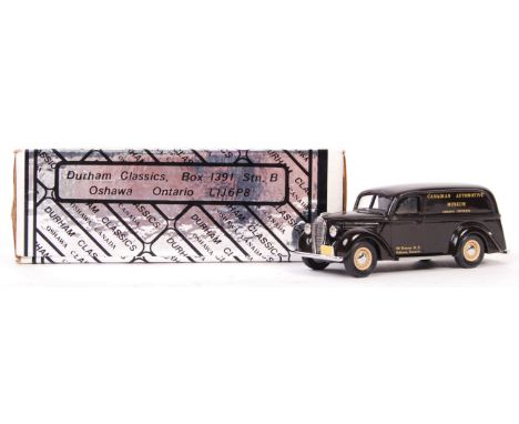 A Durham Classics Automotive Miniatures 1:43 scale diecast model DC3003A 39' Ford Panel Delivery in dark brown with Canadian 