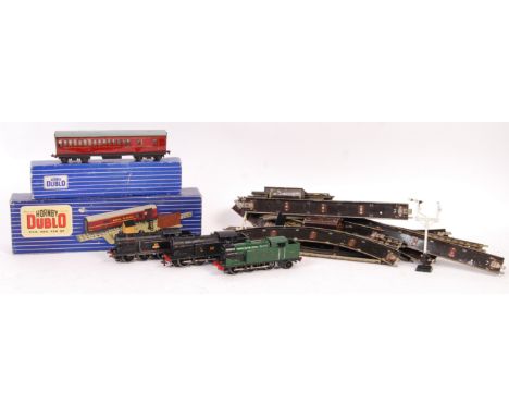 A collection of vintage Hornby Dublo 00 gauge railway trainset 3-rail locomotives and related items. Comprising: 3x 3-rail lo