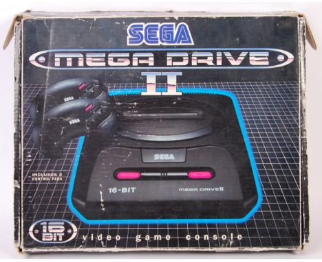 An original vintage Sega ' Mega Drive II ' 16 Bit games console. Appears complete with both controllers, power lead and TV ca
