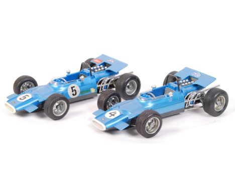 A pair of vintage Schuco made clockwork racing cars. Both variations of ' 1074 - Matra Ford Formel 1 '. Both blue, one with N
