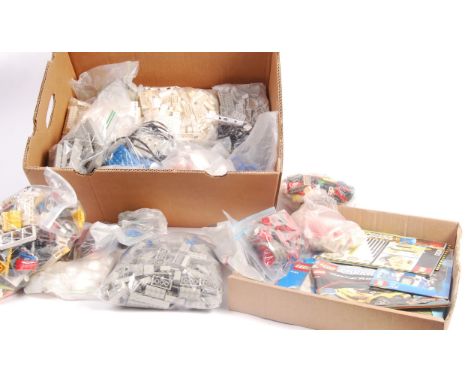 A large collection of assorted vintage loose Lego. Largely bagged by theme / colour - to include wheels, standard bricks, spe