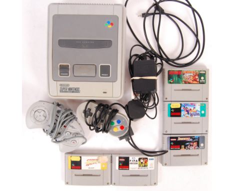 An original vintage Super Nintendo Entertainment System (SNES) (PAL) video games computer console, Console No. UP15382481. Co