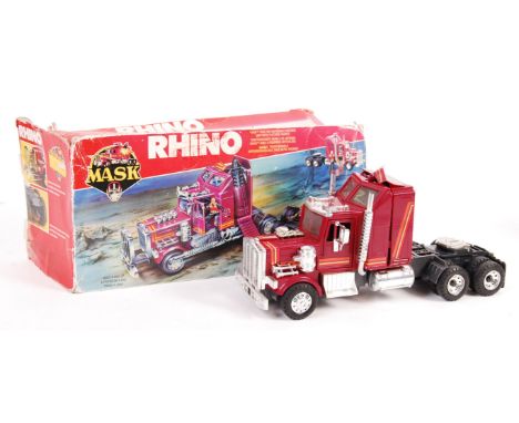 An original vintage 1980's Kenner made MASK action figure playset ' Rhino '. Appears largely complete, some smaller parts may