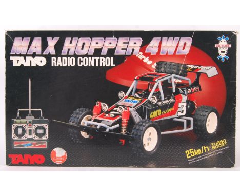 A vintage 1988 Taiyo made RC Radio Controlled Max Hopper 4WD battery operated beach buggy type car. Appears in good condition