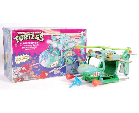 An original vintage Playmates made Teenage Mutant Hero / Ninja Turtles boxed action figure playset ' Turtlecopter '. Within i