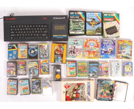 A vintage Sinclair made ZX Spectrum 128k computer games console - with a selection of original game cassettes. Games include;