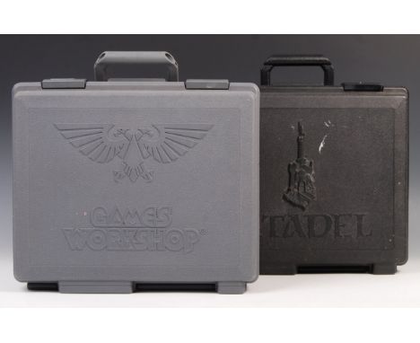 Two Games Workshop Warhammer carry cases (one black, one grey). The first case containing paints and detailing elements for W