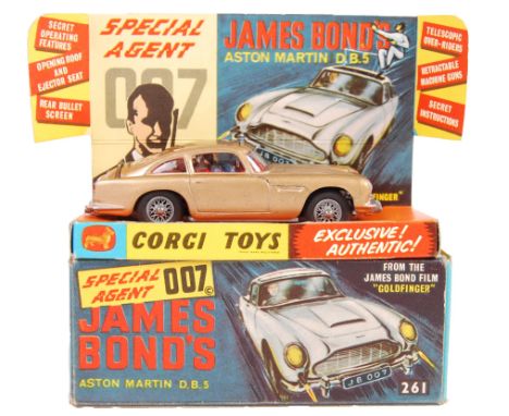 An original vintage Corgi Toys diecast model No. 261 ' James Bond 007 Aston Martin DB5 .' In gold, with silver spoked wheels.