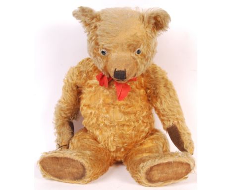 An antique / vintage c1930's likely Chiltern made ' Hugmee ' style teddy bear. Golden mohair, with clear and black glass eyes