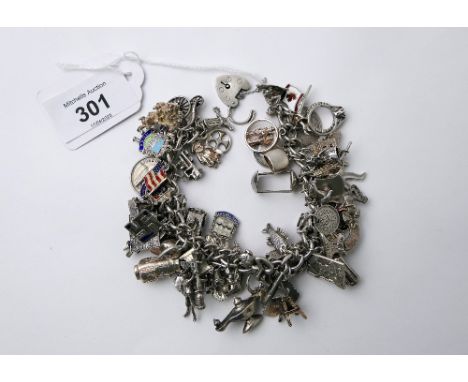White metal and silver charm bracelet with charms
