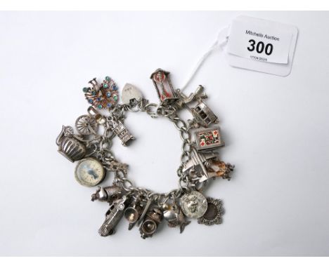 White metal and silver charm bracelet and charms