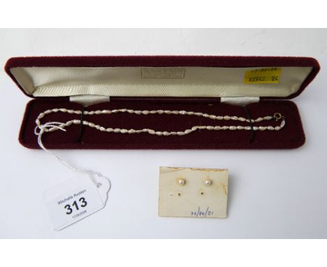 Freshwater pearl necklace and pair of pearl earrings