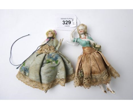 Two 19th century miniature ceramic dolls with original clothes