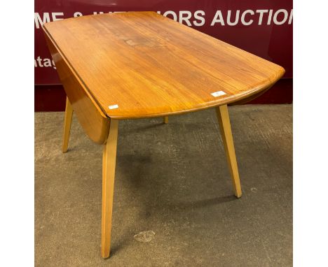 An Ercol Blonde elm and beech Windsor drop-leaf table 