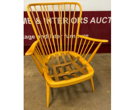 An Ercol Blonde beech 478 model Windsor armchair 
