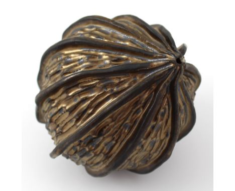 Jonathan Woodward; 'Seed Pod', a ceramic seed pod with interior rattling ceramic seeds, gold lustre glazed, approx length 10c