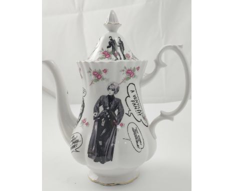 HOBOartist; a reclaimed ceramic teapot with subversive transfer decoration, 'Hobo', 'Nothing Seems Quite Real', with black an