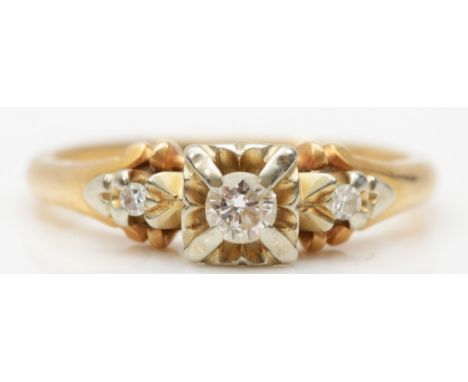 A 14k gold three stone diamond ring, central stone brilliant cut flanked by two eight cut diamonds, J-K, 2.5gm 