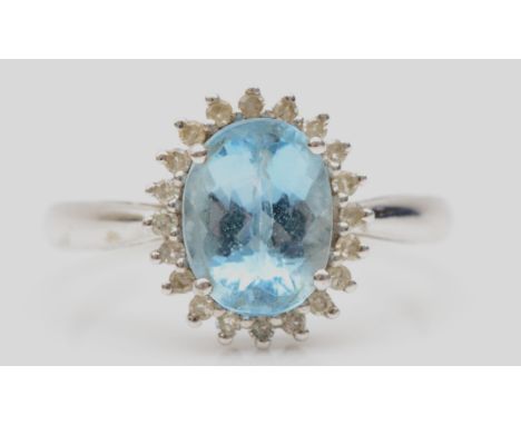 A 9ct white gold aquamarine and eight cut diamond cluster ring, R-S, 3.1gm. 